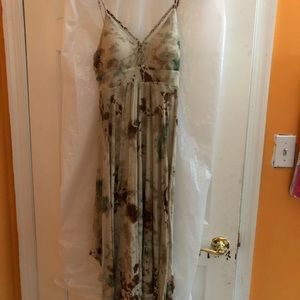 A long green and brown sleeveless dress